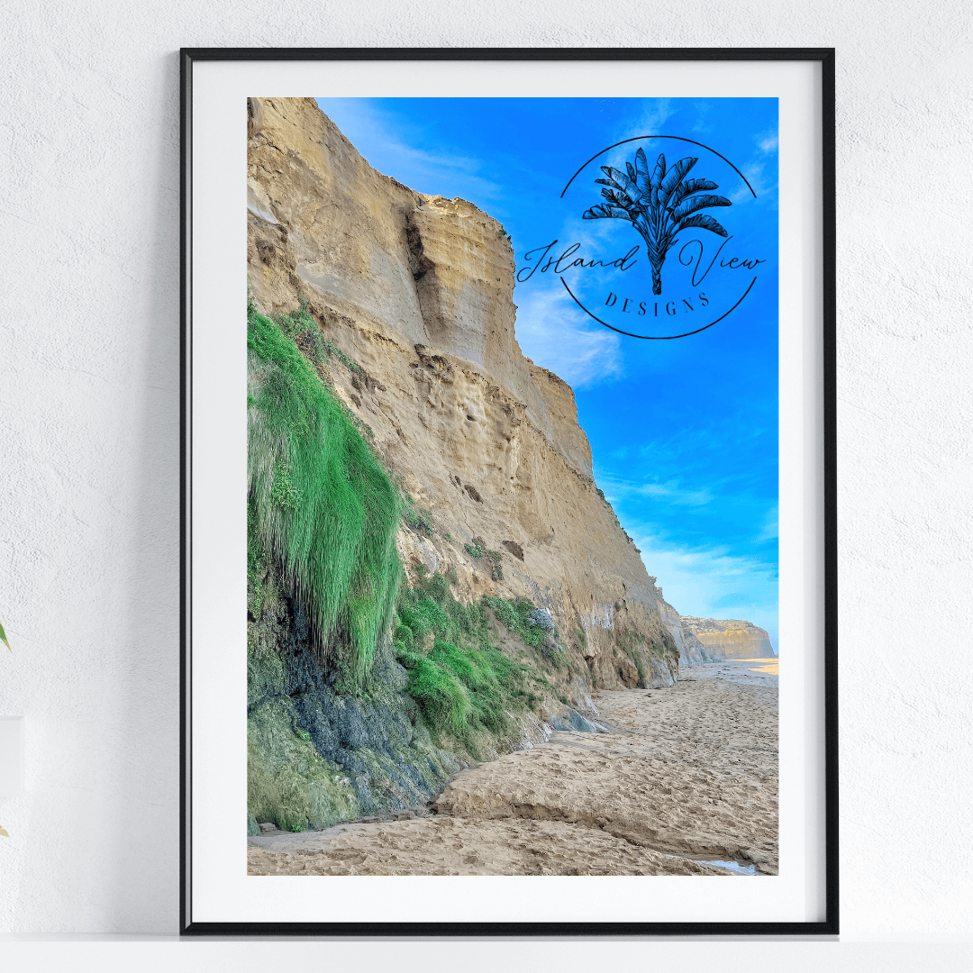 Coastal-Cliff-face-Sandy-Beach-Blue-Sky